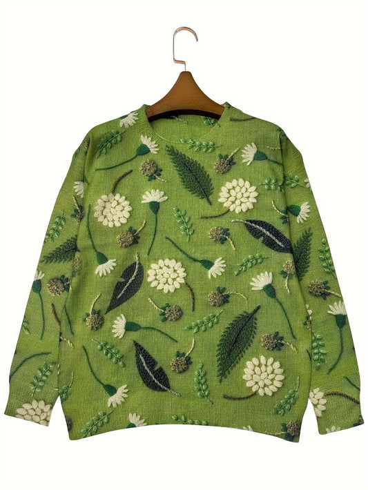 Green sweater with floral pattern on a hanger against a white background