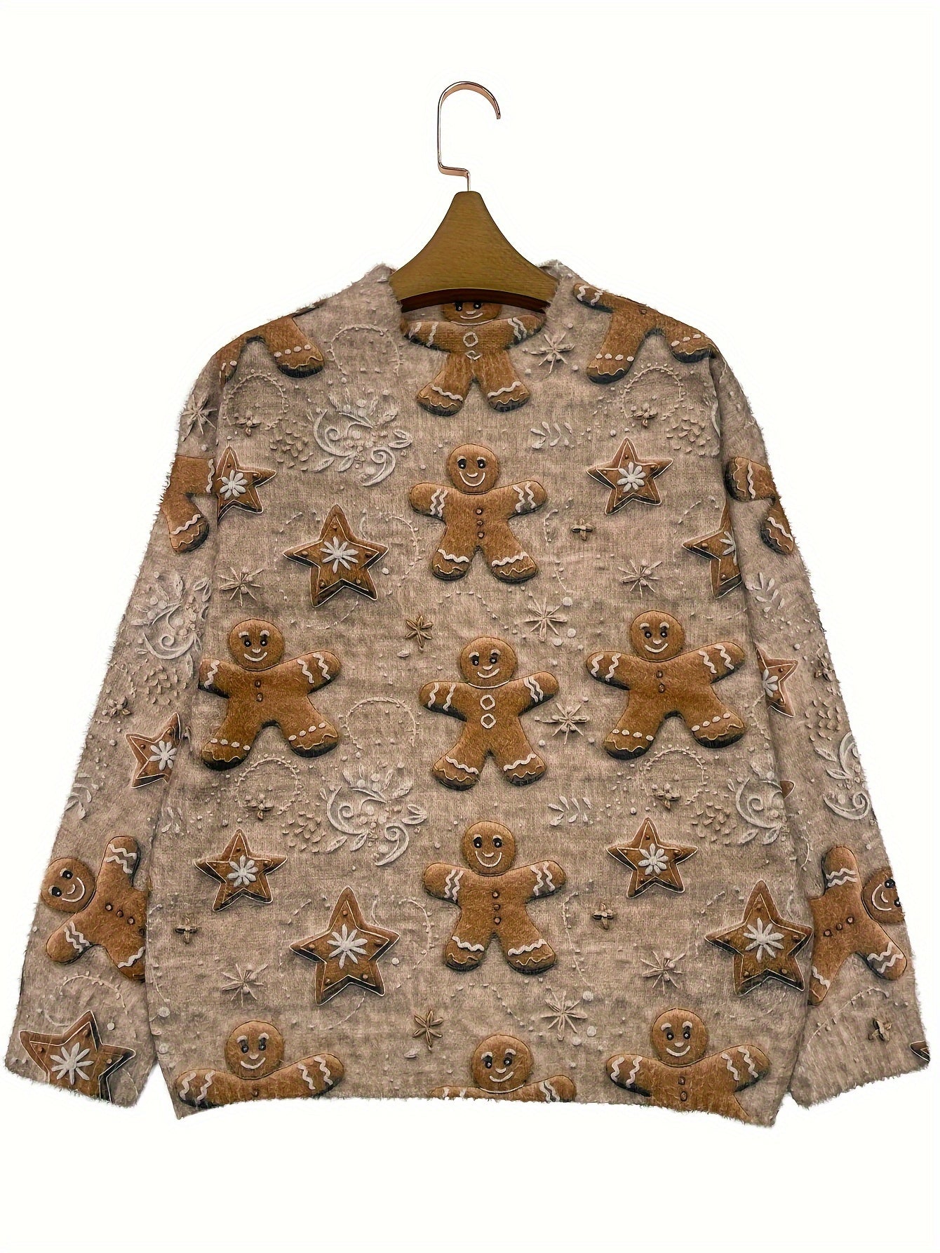 Sweater with gingerbread man and star patterns on a hanger against a white background