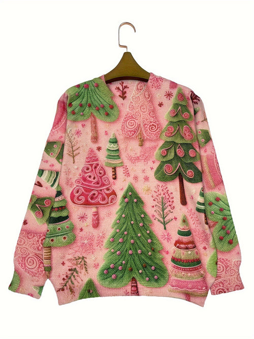 Christmas-themed sweater with green trees and pink background on a hanger