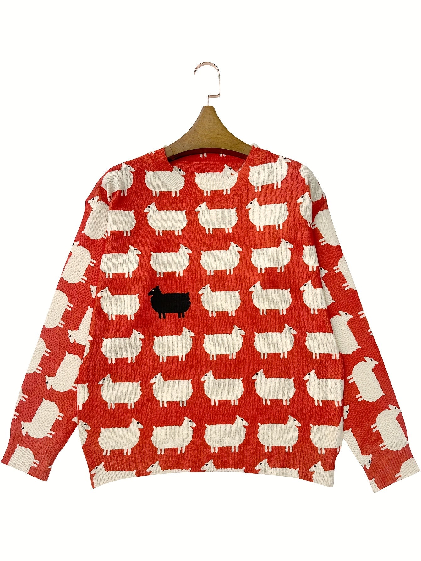 Red sweater with white sheep pattern on a hanger against a white background