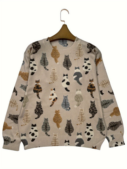 Beige sweater with cat pattern on a hanger against a white background