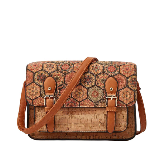 Patterned cork handbag with brown straps on a beige background