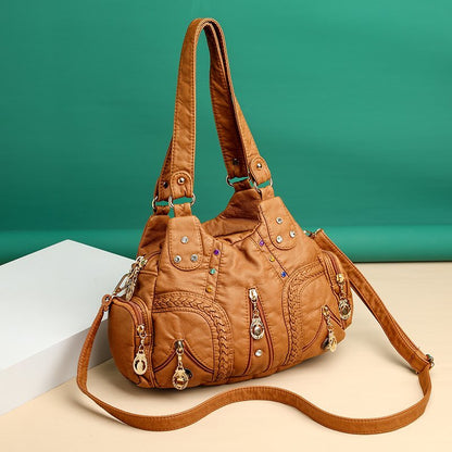 Brown handbag with decorative elements on a beige and teal background