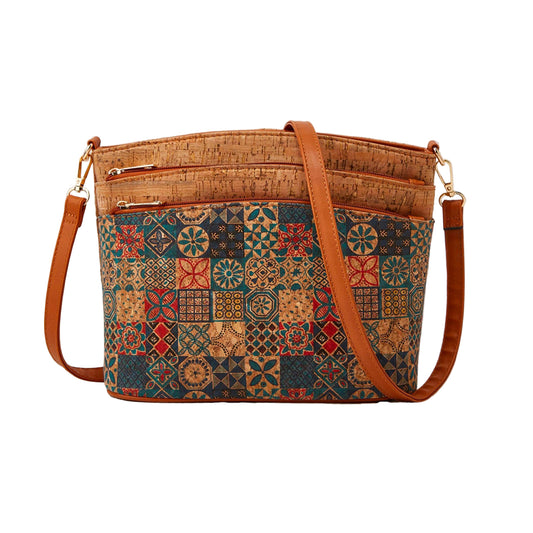 Patterned handbag with brown strap and visible brand 'Studio Nyssalie' on a beige background