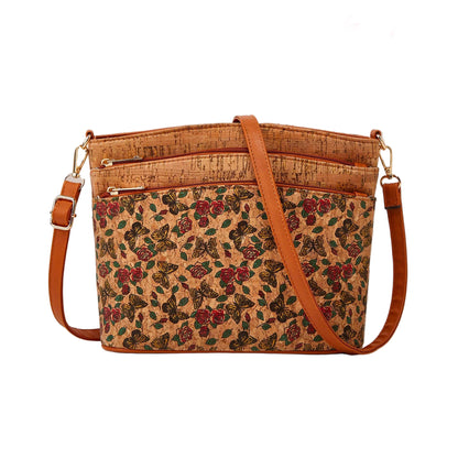 Floral-patterned cork handbag with brown leather straps on a beige background, featuring Studio Nyssalie logo.