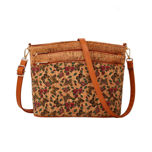 Floral-patterned cork handbag with brown leather straps on a beige background, featuring Studio Nyssalie logo.