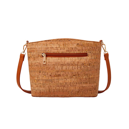 Cork handbag with brown straps on a beige background, featuring Studio Nyssalie logo.