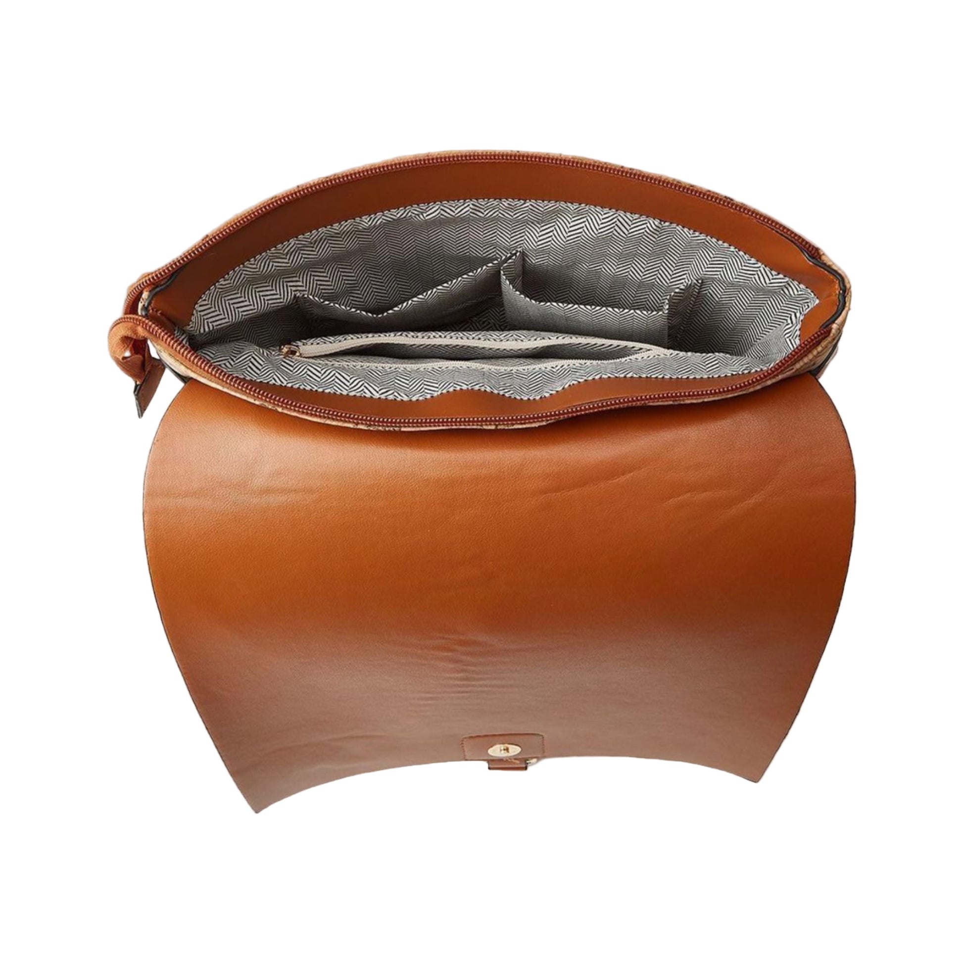 Brown leather bag with gray interior on a beige background, featuring Studio Nyssalie logo.